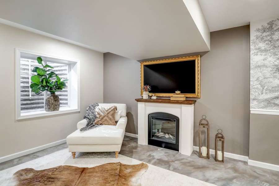 framed tv and wood fireplace in Elizabethtown Basement Remodel