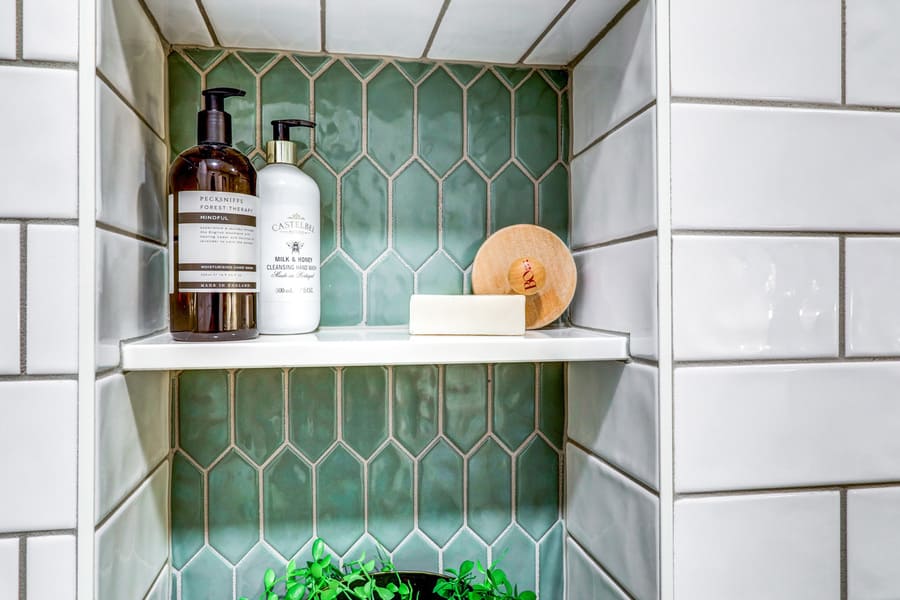 green tile shower niche with shelf in Manheim Township Primary Bathroom Remodel