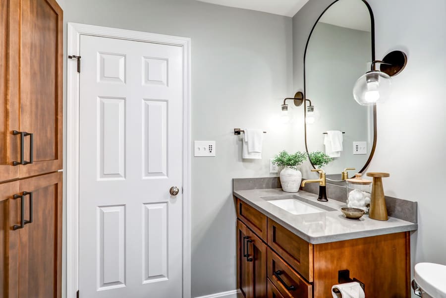 brown vanity with matte black accents in Manheim Township Primary Bathroom Remodel