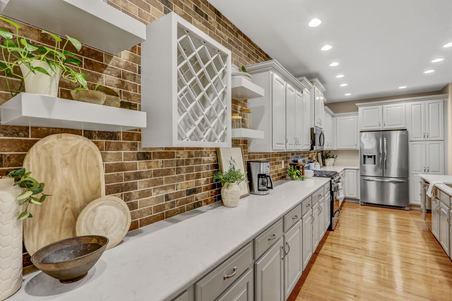 Lampeter-Strasburg kitchen refresh with custom wine rack and brick backsplash